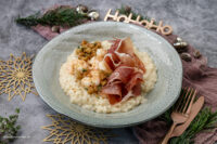 Rezept für ein leckeres Champagner-Risotto mit Garnelen und Serrano-Schinken.